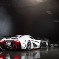 Two-post vs four-post lifts side by side in a modern home garage