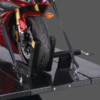 Front view of a motorcycle secured on the Forward Lift 1000MCL portable motorcycle and ATV lift, showcasing the wheel chock and tie-down straps for stability.