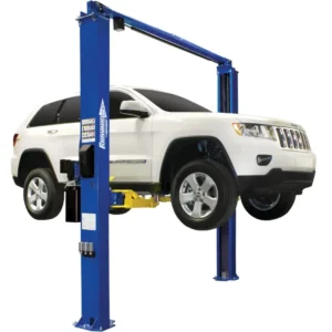 Forward Lift I10 symmetrical two post lift raising a white Jeep Grand Cherokee