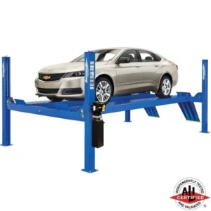 Champagne Chevy Impala on a Forward Lift CR14 four post service lift, ideal for alignment and general service, ALI certified