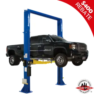 Heavy-duty GMC Denali HD truck raised on a Forward Lift DP15 two-post lift, ALI certified