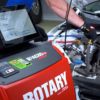 Rotary R3AC80 A/C cart connected to a vehicle's AC system during servicing.