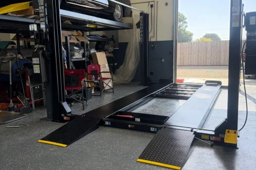 Direct Lift four-post garage lift with classic car storage setup in residential garage